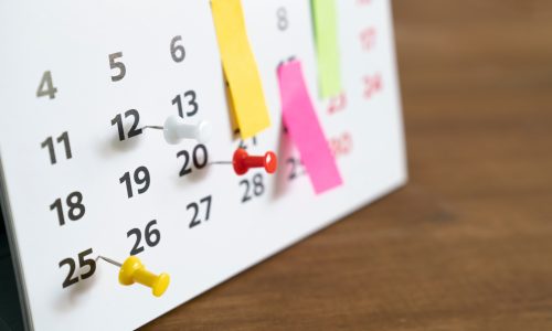 close up of calendar on the table, planning for business meeting or travel planning concept